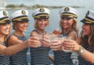 Bachelorette party in sailor hats on a deck